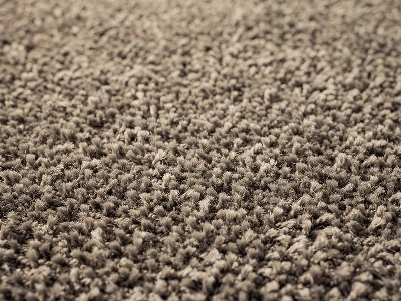 Close-up of carpet pile, the floor that needs a slide rather than a glide
