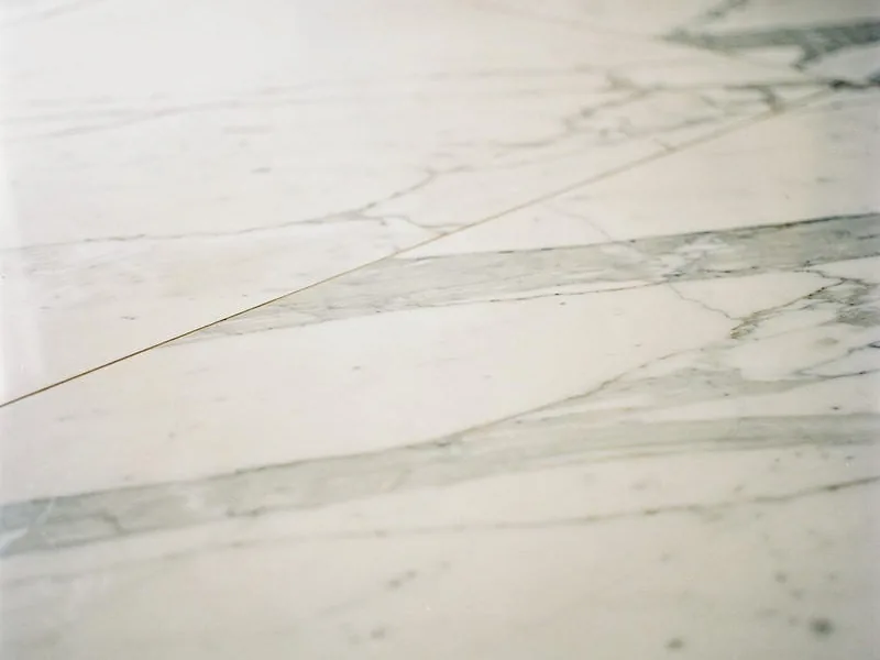 Close-up of a tile and stone floor surface
